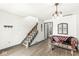 Spacious living room with hardwood floors, large windows, and comfortable seating at 9644 Highgate N Cir, Indianapolis, IN 46250