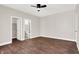 Bedroom with hardwood floors, closet, and en-suite bathroom at 2729 Massachusetts Ave, Indianapolis, IN 46218
