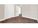 Bedroom with hardwood floors, closet and access to other rooms at 2729 Massachusetts Ave, Indianapolis, IN 46218