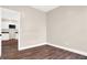 Bedroom with hardwood floors and kitchen access at 2729 Massachusetts Ave, Indianapolis, IN 46218