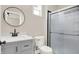 Updated bathroom with gray vanity, black fixtures, and shower at 2729 Massachusetts Ave, Indianapolis, IN 46218