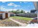 Backyard with shed, grass, and concrete walkways at 2729 Massachusetts Ave, Indianapolis, IN 46218