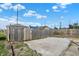 Another view of the gravel driveway and gate at 2729 Massachusetts Ave, Indianapolis, IN 46218