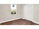 Bedroom with hardwood floors, closet, and a window at 2729 Massachusetts Ave, Indianapolis, IN 46218