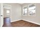 Bedroom with hardwood floors and access to another bedroom at 2729 Massachusetts Ave, Indianapolis, IN 46218