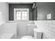Clean bathroom with white subway tile and vanity at 3860 N Delaware St, Indianapolis, IN 46205