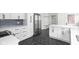 Modern white kitchen with island, stainless steel range and hexagon tile floor at 3860 N Delaware St, Indianapolis, IN 46205