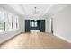 Bright dining room with hardwood floors and coffered ceiling at 3860 N Delaware St, Indianapolis, IN 46205
