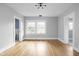 Bright bedroom with hardwood floors and access to bathroom at 3860 N Delaware St, Indianapolis, IN 46205