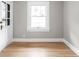 Empty room with hardwood floors and white trim at 3860 N Delaware St, Indianapolis, IN 46205