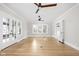 Spacious living room with hardwood floors and French doors opening to the outside at 3860 N Delaware St, Indianapolis, IN 46205