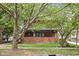 Brick house with front porch and large trees at 3860 N Delaware St, Indianapolis, IN 46205