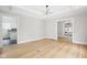Spacious dining room with hardwood floors and view into the kitchen at 3860 N Delaware St, Indianapolis, IN 46205