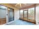 Sunroom with ceiling fan, sliding glass doors, and screened windows at 709 Silver Fox Ct, Indianapolis, IN 46217