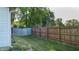 Landscaped backyard with fenced-in area at 709 Silver Fox Ct, Indianapolis, IN 46217