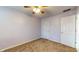 Bright bedroom with neutral walls and ceiling fan at 709 Silver Fox Ct, Indianapolis, IN 46217