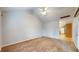 Living room with vaulted ceiling, carpet, and kitchen view at 709 Silver Fox Ct, Indianapolis, IN 46217