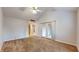 Spacious living room featuring a ceiling fan and sliding glass door access to a patio at 709 Silver Fox Ct, Indianapolis, IN 46217