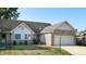Brick ranch home with attached garage and neat lawn at 709 Silver Fox Ct, Indianapolis, IN 46217