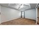 Spacious bedroom with carpeted floors, ceiling fan and window with gray curtains at 709 Silver Fox Ct, Indianapolis, IN 46217