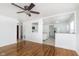 Open living room with hardwood floors and a view into the kitchen at 543 Leeds Ave, Indianapolis, IN 46203