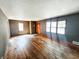 Bright living room with hardwood floors and classic wood windows at 2812 Columbus Ave, Anderson, IN 46016