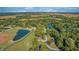 Aerial view of the property and surrounding landscape with lake access at 5745 Paradise Dr, Martinsville, IN 46151