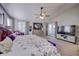 Bright and airy bedroom with a king-size bed, large TV, and access to a private balcony at 5745 Paradise Dr, Martinsville, IN 46151