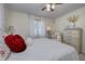 Serene bedroom with a queen bed, soft bedding, and a dresser with ample storage at 5745 Paradise Dr, Martinsville, IN 46151