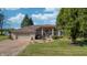 Brick home with attached garage and landscaping at 5745 Paradise Dr, Martinsville, IN 46151