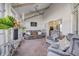 Bright sunroom with comfortable seating and a ceiling fan at 5745 Paradise Dr, Martinsville, IN 46151