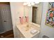 Bright bathroom with a vanity, large mirror, and pink towels at 8850 Crystal Lake Dr, Indianapolis, IN 46240