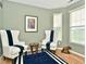 Cozy sitting area with two armchairs, a small table, and a rug at 8850 Crystal Lake Dr, Indianapolis, IN 46240