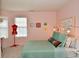 Bright bedroom with a teal comforter and plenty of natural light at 8850 Crystal Lake Dr, Indianapolis, IN 46240
