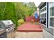 Private back deck with built-in seating and grill at 8850 Crystal Lake Dr, Indianapolis, IN 46240