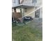 Backyard patio with seating area and some clutter at 1804 N Delaware St, Indianapolis, IN 46202