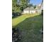Large backyard with grassy area and basketball hoop at 1804 N Delaware St, Indianapolis, IN 46202