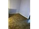 Small bedroom with purple walls and brown carpet at 1804 N Delaware St, Indianapolis, IN 46202
