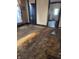 Living room features stained carpet and a view into the kitchen at 1804 N Delaware St, Indianapolis, IN 46202