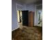 Bedroom with purple walls, brown carpet, and access to bathroom at 1804 N Delaware St, Indianapolis, IN 46202