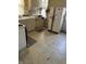 Dated kitchen needing updates, features white tile and appliances at 1804 N Delaware St, Indianapolis, IN 46202