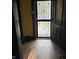 Entryway with dark wood door and patterned tile floor at 1804 N Delaware St, Indianapolis, IN 46202
