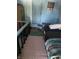Small bedroom with a bed, dresser, and adjacent door at 1804 N Delaware St, Indianapolis, IN 46202