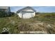 Detached garage with double doors and gravel driveway at 1452 E Sr 234, Greenfield, IN 46140