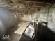 Unfinished basement with exposed beams and concrete floor at 1452 E Sr 234, Greenfield, IN 46140