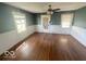 Bright living room with hardwood floors and wainscoting at 1452 E Sr 234, Greenfield, IN 46140
