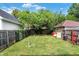 Spacious backyard with a grassy area and a detached garage at 340 Blue Ridge Rd, Indianapolis, IN 46208