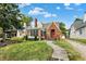 Charming brick home with a landscaped yard and screened porch at 340 Blue Ridge Rd, Indianapolis, IN 46208