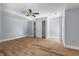 Bright bedroom with ceiling fan and hardwood floors at 9259 Oak Knoll Ln, Fishers, IN 46037