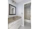 Bathroom with vanity, mirror, and tub/shower combo at 9259 Oak Knoll Ln, Fishers, IN 46037